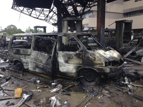 The charred wreckage of a minivan is seen at a gas station that exploded overnight killing around 90 people in Accra, Ghana, June 4, 2015. Many people were sheltering at the filling station due to torrential rain, on Wednesday night, the fire brigade said. The blast was caused by a fire that erupted at a nearby lorry terminal then spread to the petrol station and other buildings, fire brigade spokesman Prince Billy Anaglate said. REUTERS/Matthew Mpoke Bigg