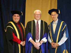 Jean-Marc Aubin poses with Laurentian University president Dominic Giroux and Laurentian chancellor Steve Paikin in Sudbury on Wednesday. Aubin, a champion for French-language education, was presented with a honorary doctorate of laws at the afternoon convocation ceremony. Gino Donato/Sudbury Star