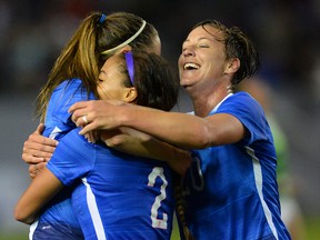 USA midfielder Morgan Brian (14) , forward Sydney Leroux (2) and forward Abby Wambach (20) celebrate a goal in the second half of the game against Mexico at StubHub Center. USA won 5-1. (Jayne Kamin-Oncea-USA TODAY Sports)