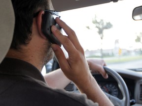 Distracted driving penalties are being stiffened by the Selinger government. (WINNIPEG SUN FILE PHOTO)