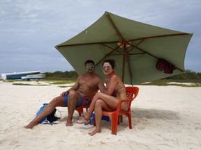 British tourist Matthew Napier (L), 35, and Aiskel Rendon, a 31-year-old Venezuelan, pose for a picture at a beach in the archipelago of Los Roques May 29, 2015.
Reuters/Carlos Garcia Rawlins
