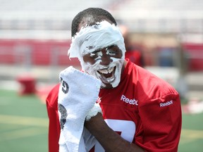 Ottawa RedBlacks quarterback Henry Burris cleans up after taking a shaving cream pie to the face in honour of his 40th birthday on Thursday, June 4, 2015 (Chris Hofley/Ottawa Sun)