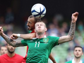 Ireland’s James McClean (front) is challenged by Turkey’s Ahmet Ilhan Ozek during their international friendly at Aviva Stadium in Dublin May 25, 2014. (REUTERS/Cathal McNaughton)