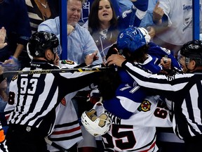 Victor Hedman of the Tampa Bay Lightning and Andrew Shaw of the Chicago Blackhawks get involved after the whistle in the first period during Game 1 of the 2015 Stanley Cup Final at Amalie Arena on June 3, 2015. (Mike Carlson/Getty Images/AFP)