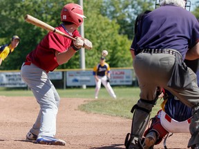 Frontenac Falcons' Shamus Barr reaches to connect with the pitch from Napanee Golden Hawks pitcher Josh Murphy during the third inning of a Kingston Area Secondary Schools Athletic Associations baseball semifinal game at Megaffin Park on Thursday. The Falcons beat the Golden Hawks 2-0. (Julia McKay/The Whig-Standard)