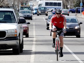 A cyclist rides along a bike lane on 76 Avenue near 107 Street, in Edmonton. (EDMONTON SUN/File)