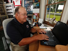 In this 2011 file photo, Scotty Bowman works away inside the office of his Amherst, NY. (JIM COURTNEY/STR/QMI AGENCY)