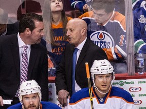 Interim Oilers head coach Todd Nelson, left, talks to associate coach Keith Acton, who the Oilers released on Thursday. (Carmine Marinelli, Postmedia Network)