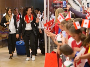 Canada's Women's World Cup team arrives to a large group of fans at the Edmonton International Airport on Tuesday, June 2, 2015. (David Bloom/Postmedia Network)