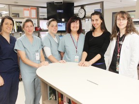 As the summer months come upon us, staff in Alexandra Marine and General Hospital’s emergency room would like to remind patients that wait times may increase due to higher volumes. Pictured here are ER staff, Nicole Brideau, ER ward clerk, Cheryl Wilts, nursing student, Melissa Wraith, registered nurse, Donna Phillips-Grande, registered nurse, Dr. Katayun Treasurywala and Marie Greer-King, nurse practitioner.   (Dave Flaherty/Goderich Signal Star)