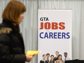 A woman walks through the 2014 Spring National Job Fair and Training Expo in Toronto, in this April 3, 2014, file photo. (REUTERS/Aaron Harris/Files)