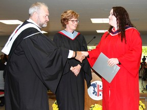 SUBMITTED PHOTO
Rietta Brown of Belleville receives The Governor General’s Award from Loyalist College president and CEO Maureen Piercy and senior vice-president, Academic and Student Success, John McMahon during the first of four convocation ceremonies held at Loyalist in Belleville.