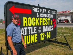 TIM MILLER/THE INTELLIGENCER
Robin Brant stands in front of a sign advertising his upcoming rock festival in Tyendinaga Mohawk Territory. His property, across from the Free Flow gas station, will be the site of a three day festival June 12 to 14.