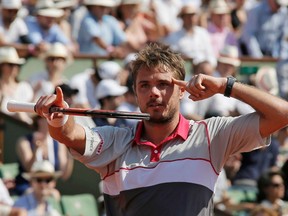 Stan Wawrinka celebrates after defeating Jo-Wilfried Tsonga during their men's semifinal match at the French Open in Paris on Friday, June 5, 2015. (Gonzalo Fuentes/Reuters)