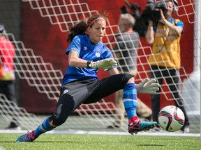 Team Canada's Stephanie Labbe makes a save during practice at Commonwealth Stadium.