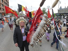 A group of people marched from the University of Winnipeg to Thunderbird House in Winnipeg, after hearing the findings of the Truth and Reconciliation Commission's findings on June 2, 2015. (Chris Procaylo/Winnipeg Sun)