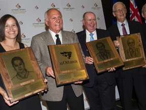 Inductees into the 2015 class of the Ottawa Sports Hall of Fame include (L-R) former Canadian Soccer team regular Kristina Kiss, the 1975 undefeated Vanier Cup-winning University of Ottawa Gee Gees Football team-represented by head coach Don Gilbert, Dave “The Voice” Schreiber, Senators General Manager Bryan Murray and longtime Hockey patron Charlie Henry. The ceremony was held Friday, June 5, 2015.
Errol McGihon/Ottawa Sun