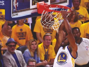 Warriors’ Andre Iguodala throws down a dunk against the Cavs during Game 1 on Thursday. (USA TODAY SPORTS)