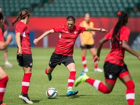 Canada's Christine Sinclair kicks the ball during a practice session at Commonwealth Stadium in Edmonton, Alberta, on June 5, 2015 as the team prepares for their first match against China in the FIFA Women's World Cup which starts June 6. (AFP PHOTO/GEOFF ROBINS)