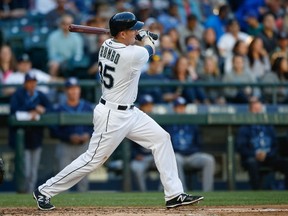 Mark Trumbo singles in his Mariners debut on Thursday night. (AFP)