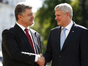 Ukraine's President Petro Poroshenko (left) welcomes Canada's Prime Minister Stephen Harper during a meeting in Kiev, Ukraine, June 6, 2015. (VALETYN OGIRENKO/Reuters)