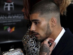 Former One Direction member Zayn Malik arrives at the fifth annual Asian Awards in the Grosvenor House Hotel, London April 17, 2015. REUTERS/Cathal McNaughton