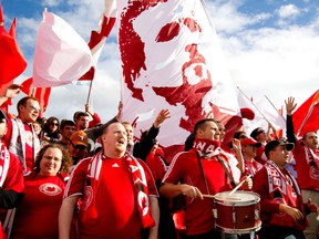 CAPTION: Fans from the Voyageurs, Canada's unofficial national soccer support group, cheer on the home side during a 2010 match against Peru. PHOTO SUPPLIED/Voyageurs