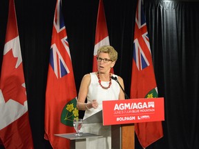 Premier Kathleen Wynne answers questions from the media following her keynote speech at the Ontario Liberal Party annual general meeting at Blue Mountain Resort near Collingwood, Ont., on June 6, 2015. (Paul Brian/Postmedia Network)