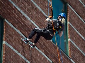 Ottawa Sun reporter Dani-Elle Dube shown here rappelling down the wall of the Courtyard Marriott on Saturday, June 6, 2015. She took part in the Make A Wish Foundation's 2nd annual Rope for Hope event.
DANI-ELLE DUBe/Ottawa Sun