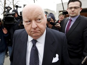 Suspended Senator Mike Duffy leaves the Ontario Court of Justice, in Ottawa, Canada, April 8, 2015. Duffy, a former ally of Canadian Prime Minister Stephen Harper, is on trial for fraud and bribery in a high-profile case that could hurt the ruling Conservatives' chances of winning an election this October.    REUTERS/Blair Gable