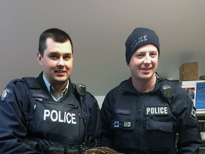 RCMP Const. Derek Bigger and Aux. Const. Darren Forsyth with the fawn they delivered early Saturday morning. (Halifax District RCMP)