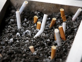 Cigarette butts are seen at an ash tray at a smoking area outside a shopping mall.

REUTERS/Kim Kyung-Hoon