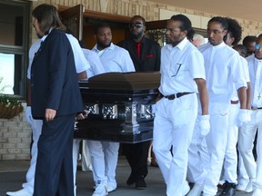 Friends and family bid farewell to Marlon Lennox Mason, 33, also known as "Shaggy," at an emotional funeral service in Rexdale Saturday afternoon. Pall bearers, dressed all in white, carry the the murder victim's casket from Glendale Funeral Home on June 6, 2015 (Chris Doucette/Toronto Sun)