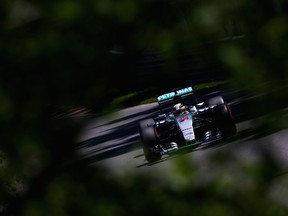Lewis Hamilton of Great Britain and Mercedes GP drives during qualifying for the Canadian Formula 1 Grand Prix at Circuit Gilles Villeneuve on Saturday in Montreal. He claimed the pole despite only taking nine practice laps. (AFP/PHOTO)