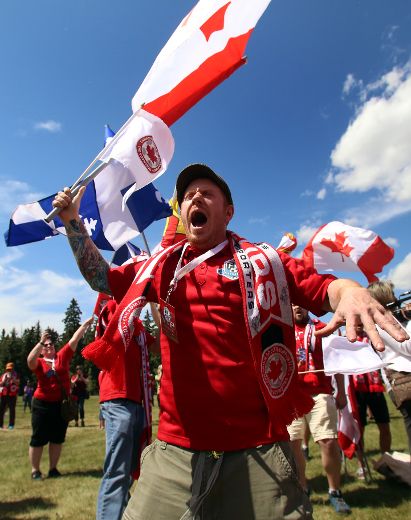 Hundreds of Canada soccer supporters march on the streets of Edmonton