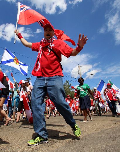 Hundreds of Canada soccer supporters march on the streets of Edmonton