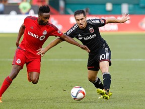 United forward Fabian Espindola (right) and TFC defender Warren Creavalle battle for the ball on Saturday night at Robert F. Kennedy Memorial Stadium. (USA TODAY SPORTS/PHOTO)