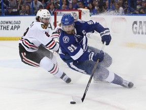 Tampa Bay Lightning captain Steven Stamkos skates with the puck against Chicago Blackhawks defenceman Duncan Keith during Game 2 of the Stanley Cup final on Saturday night. (Kim Klement/USA TODAY Sports)