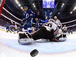Cedric Paquette of the Lightning scores on Blackhawks’ Corey Crawford during the first period of Game 2 on Saturday night in Tampa. (AFP/PHOTO)
