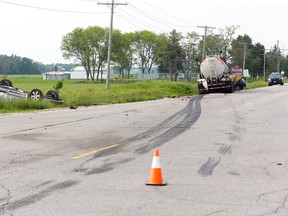 An Oshawa woman was killed when the car she was driving collided with a tanker truck at the intersection of Centre Road and Nairn Road in Middlesex County, Ont. on Friday June 5, 2015. The male driver of the SUV in the foreground was taken to hospital with non life threatening injuries he sustained avoiding the collision. Derek Ruttan/The London Free Press/Postmedia Network