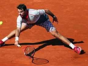 Stan Wawrinka hits a return to Novak Djokovic during the French Open final at Roland Garros in Paris, France, June 7, 2015. (GONZALO FUENTES/Reuters)