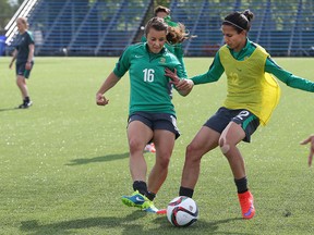 Midfielder Hayley Raso (left) and forward Leena Khamis of the Matildas collide as Australia practises at the Waverley Soccer Complex in Winnipeg on June 5, 2015, in advance of the 2015 FIFA Women's World Cup. (Kevin King/Winnipeg Sun)