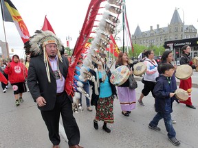 A group of people marched from the University of Winnipeg to Thunderbird House in Winnipeg, after hearing the findings of the Truth and Reconciliation Commission's findings on June 2, 2015. (Chris Procaylo/Winnipeg Sun)