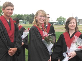 Jesse Driedger of Leamington, Chelsey Galkowski of Woodstock and Charlotte Hogan of Wallaceburg wait for their cue to lead the procession of nearly 300 students during Friday's graduation ceremony at the University of Guelph's Ridgetown Campus. 
PHOTO taken Friday, June 5, 2015 at Ridgetown, Ontario. (BLAIR ANDREWS/ CHATHAM THIS WEEK/ POSTMEDIA NETWORK)