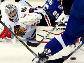 Corey Crawford #50 of the Chicago Blackhawks tends goal against the Tampa Bay Lightning during Game Two of the 2015 NHL Stanley Cup Final at Amalie Arena on June 6, 2015 in Tampa, Florida. (Bruce Bennett/Getty Images/AFP)