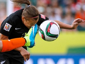 New Zealand Ria Percival (2) is kicked in the face by Lieke Martens (11) during the second half of a FIFA Women's World Cup 2015 match between New Zealand and the Netherlands at Commonwealth Stadium in Edmonton, Alta., on Saturday June 6, 2015. Ian Kucerak/Edmonton Sun/Postmedia Network