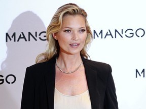 British model Kate Moss poses during the launch of the new Mango 2012 collection in London January 24, 2012.  REUTERS/Stefan Wermuth