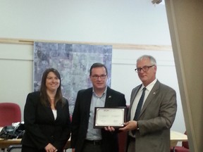 Mayor Glenn McLean (middle) received an award for Drayton Valley’s outstanding contribution in helping Nicaragua with their eco-tourism park -- a project that ended recently. McLean received the award from (left) Eve Dufresne, Program Manager, MPED Asia, FCM International and Jacques Carriere, Program Director MPED, FCM International (right). Full story on page 18.