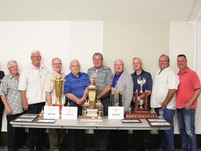 From left to right are former directors: Dave Davey, Hal Anker, Bruce Clemmer, Cec Koethler, Brian Winder, Howard Ganske, Ernie Malanowich, Fred Bouman, Cliff Erikson, Tim Mitchell, and Mark Cheyne.