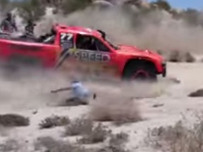 Former NASCAR driver Robby Gordon hits a spectator during the Baja 500 off-road race in Mexico. (YouTube screen grab)